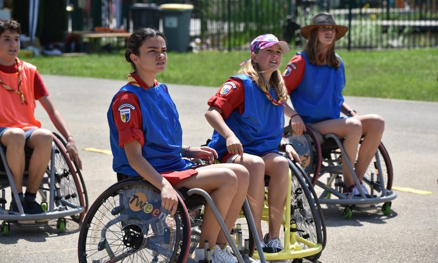 3 young women in wheelchairs dressed in sport clothing